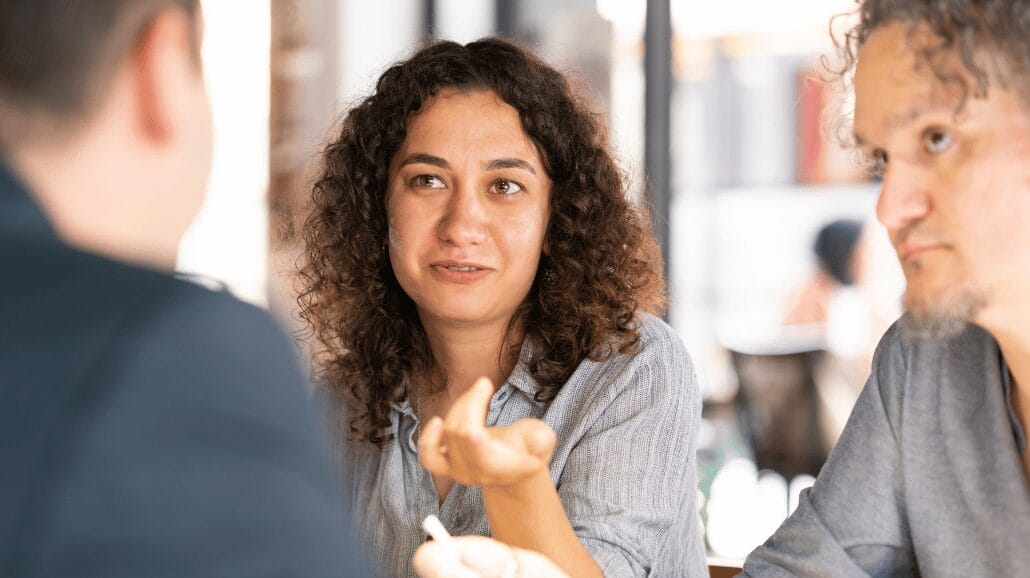 Franchisee couple talking with a franchisor