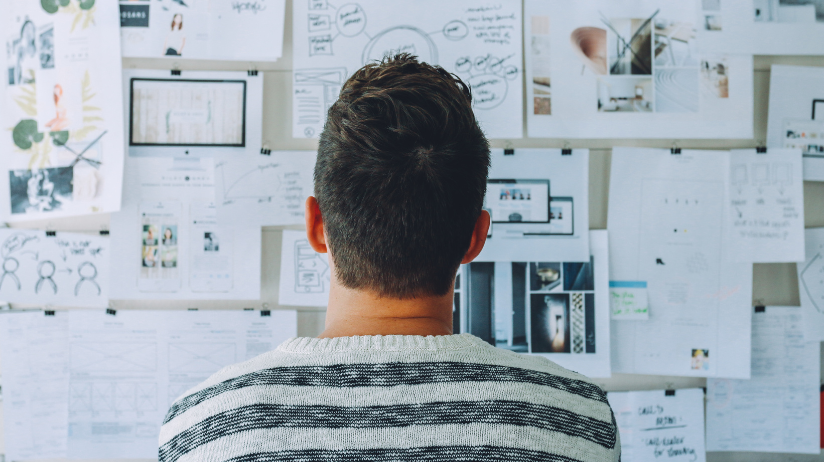 Young man looking at a concept board