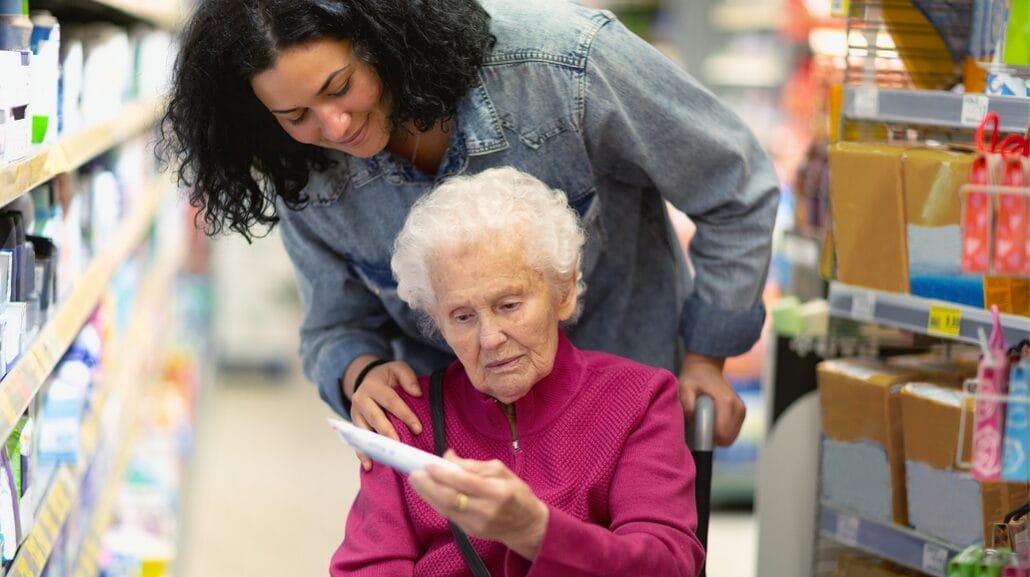 Blog Covers – 2025-08-26T151459.103 Caregiver helping a senior woman with grocery shopping