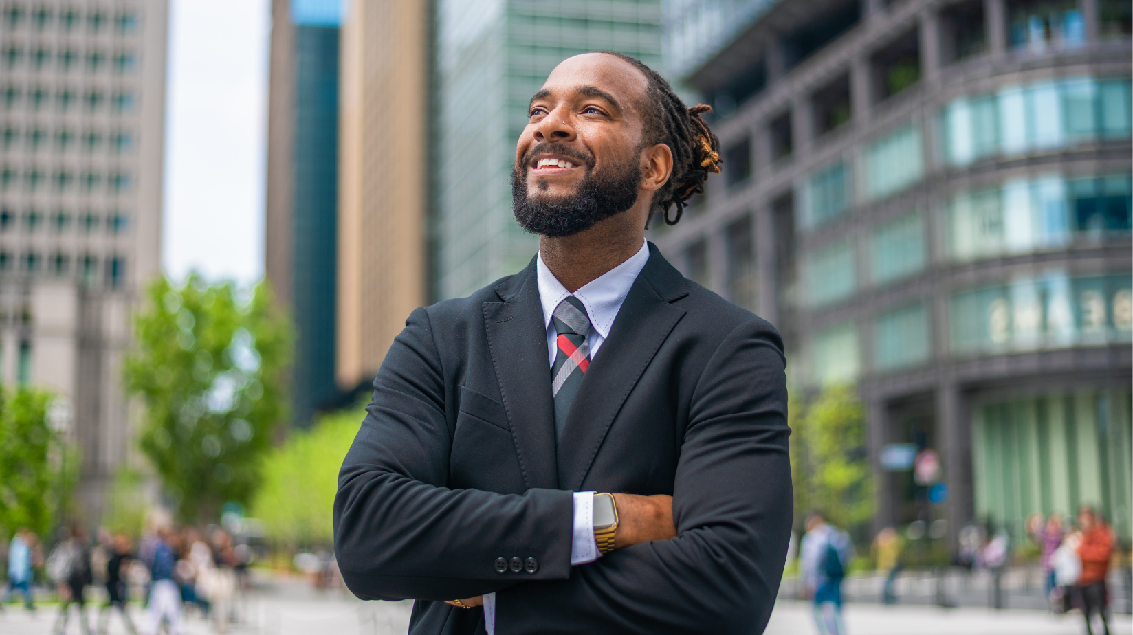 Smiling entrepreneur outside in a busy city